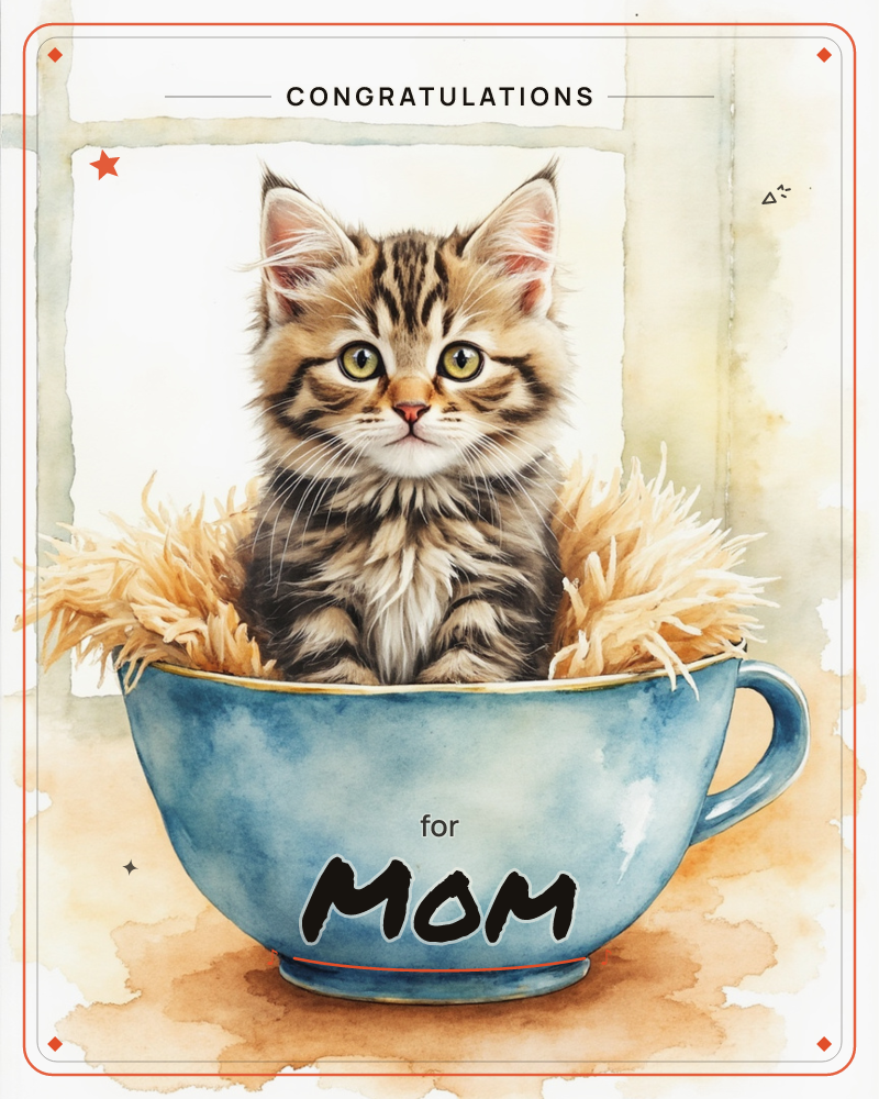 A tabby kitten sits nestled in soft golden straw inside an oversized blue teacup, its wide eyes gazing straight out at the viewer, a congratulations e-card design
