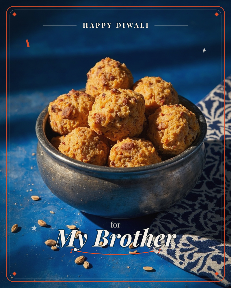 A metal bowl piled high with golden-orange sweet balls sits on a deep blue surface, scattered fennel seeds nearby and a navy patterned cloth draped to…, a diwali e-card design