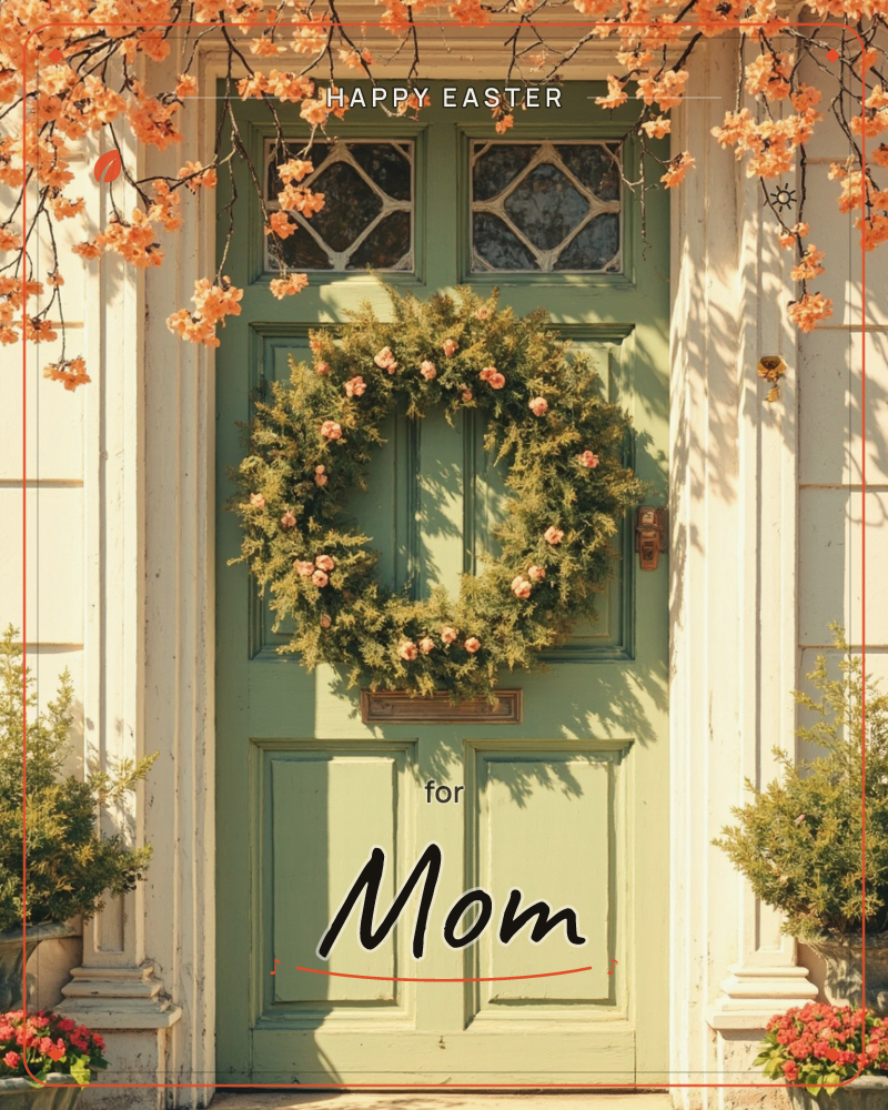 A sage-green paneled front door is dressed with a lush greenery wreath dotted with small pink roses, framed by diamond-paned windows above, a easter e-card design