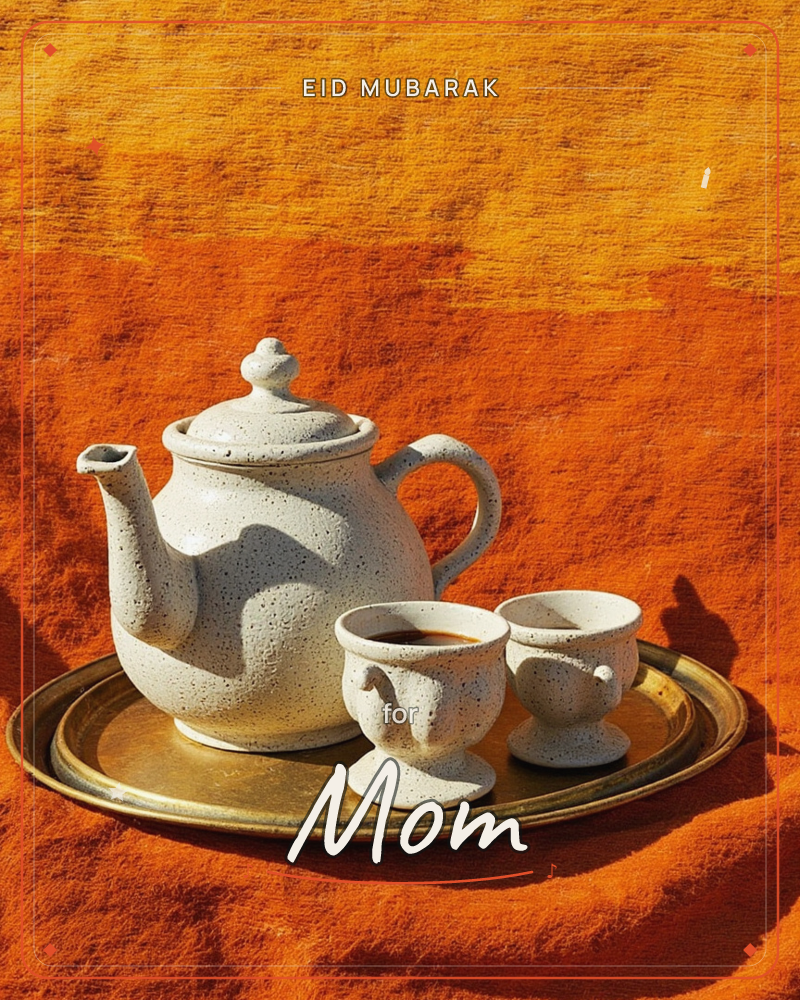 A speckled ceramic teapot and two small footed cups sit on a worn brass tray, photographed on a rich orange textile background, a eid e-card design
