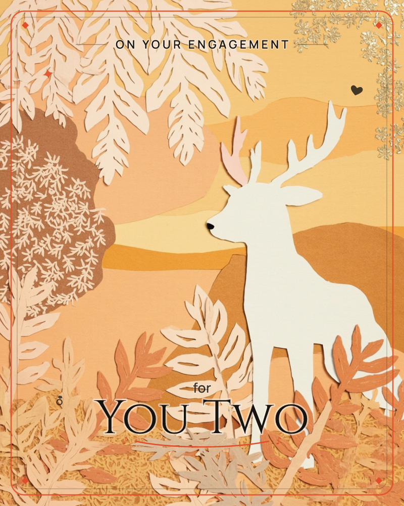 A white stag with full antlers stands amid layered paper-cut foliage, framed by rolling amber hills and a soft glowing horizon, a engagement e-card design