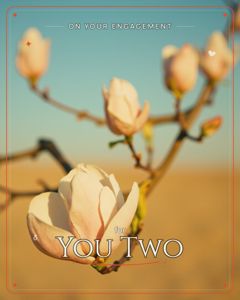 A magnolia branch stretches across the frame, its pale pink-white blossoms just unfurling against a soft blue sky and a blurred golden field below, a engagement e-card design