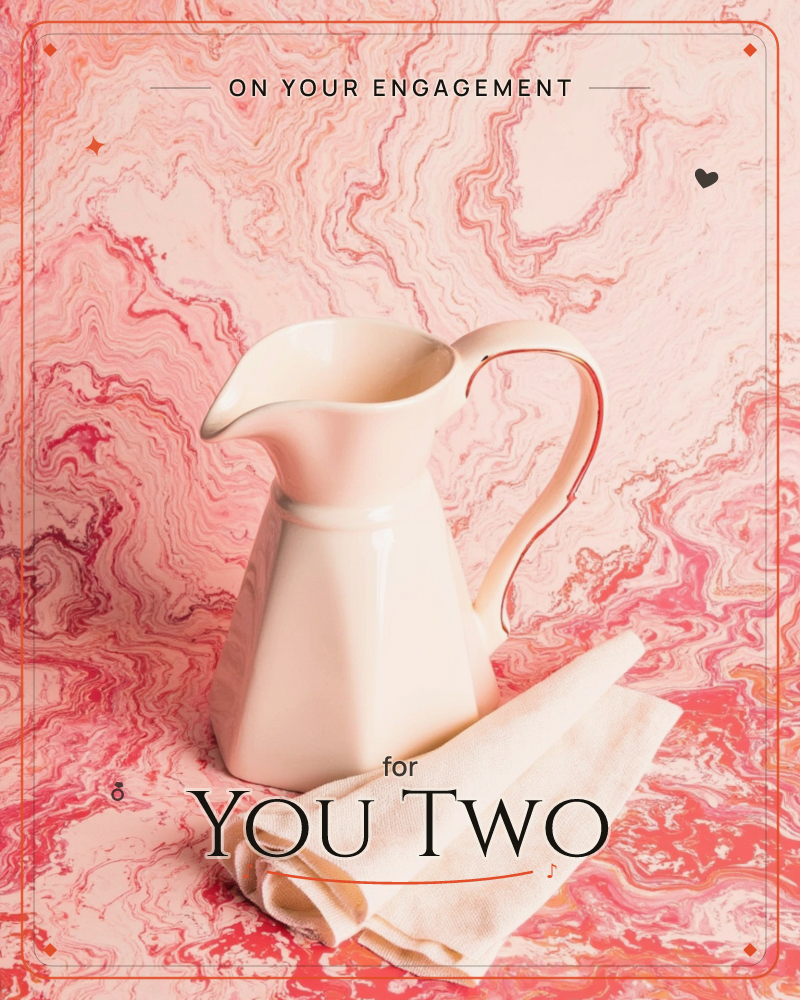 A cream enamel pitcher with a curved handle stands on a swirling marbled backdrop of pink, coral and white, a folded cream cloth napkin resting beside…, a engagement e-card design