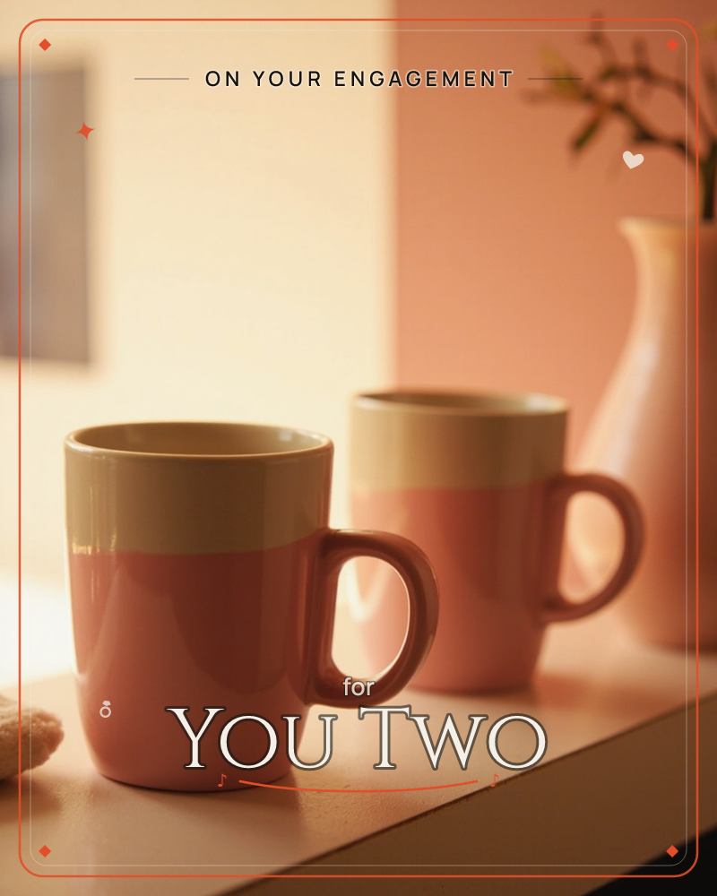 Two matching mugs in cream and dusty coral sit side by side on a pale shelf, catching a warm slant of afternoon light, a engagement e-card design