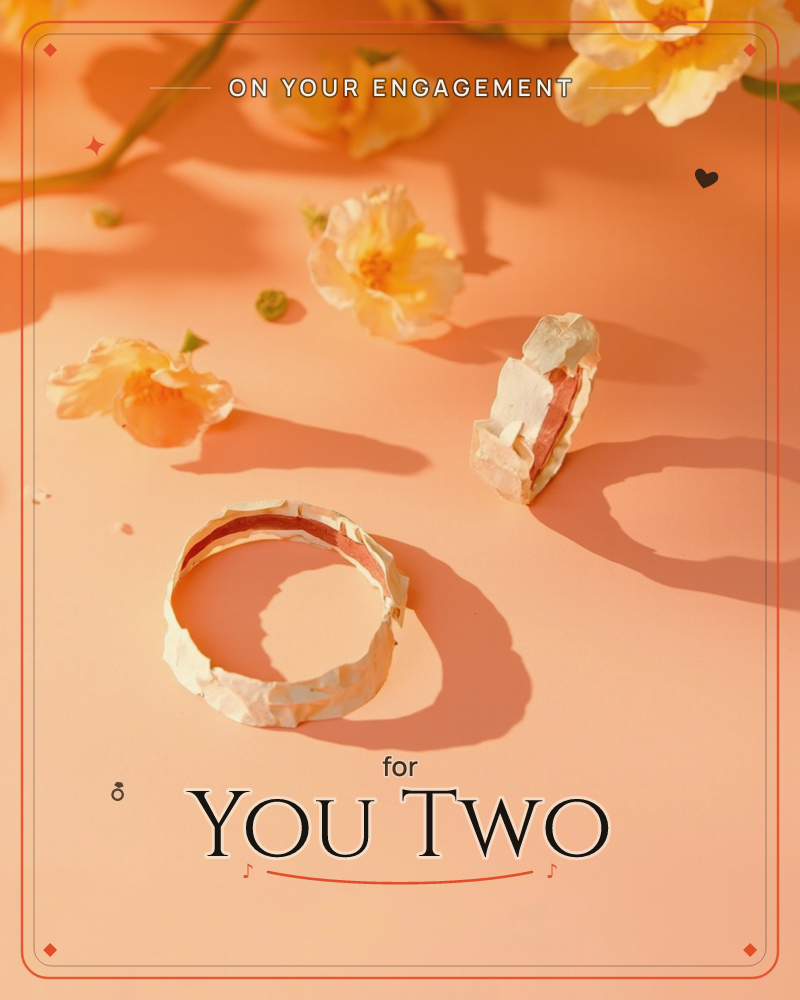 A photographic still life shows a hammered gold band lying on a peach-toned surface, its partner ring standing upright nearby, both casting long sharp…, a engagement e-card design