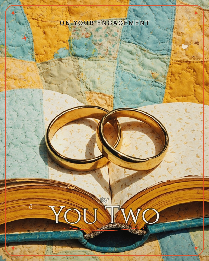 Two gold wedding bands rest overlapped on the open pages of a worn, deckle-edged book, its paper flecked with pressed bits of fibre, a engagement e-card design