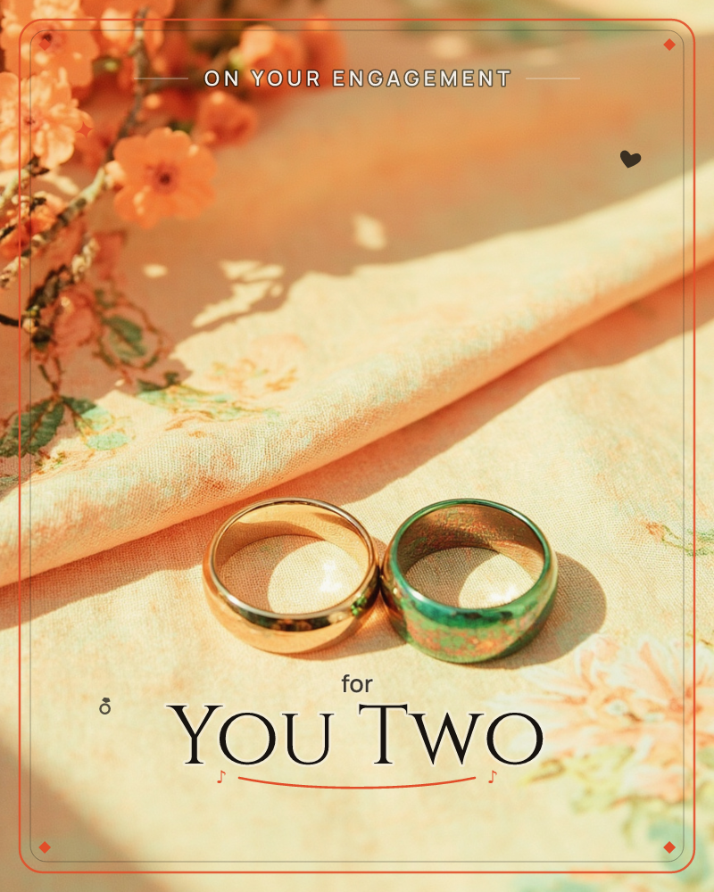Two wedding bands, one plain gold and one gold banded with green stone, rest side by side on a soft peach floral cloth, a engagement e-card design
