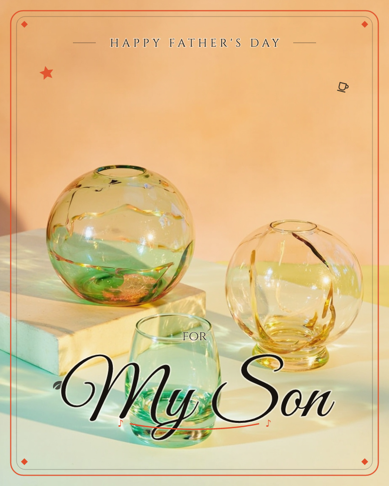 Three round glass vessels catch warm light against a peach-toned backdrop: a large green sphere vase perched on a pale block, a smaller amber globe…, a fathersday e-card design