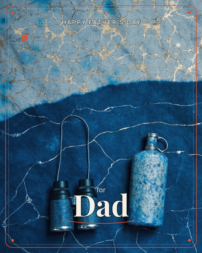 A flat-lay still life shows a pair of binoculars and a speckled travel flask resting on a textured indigo surface, marbled with fine gold and silver…, a fathersday e-card design