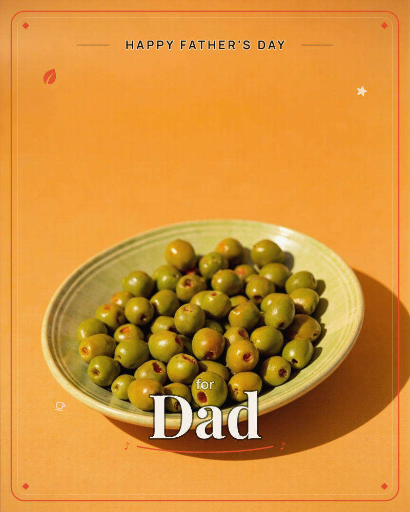 A shallow ceramic bowl heaped with plump green olives sits on a warm burnt-orange surface, photographed in bright, direct light that casts a crisp…, a fathersday e-card design