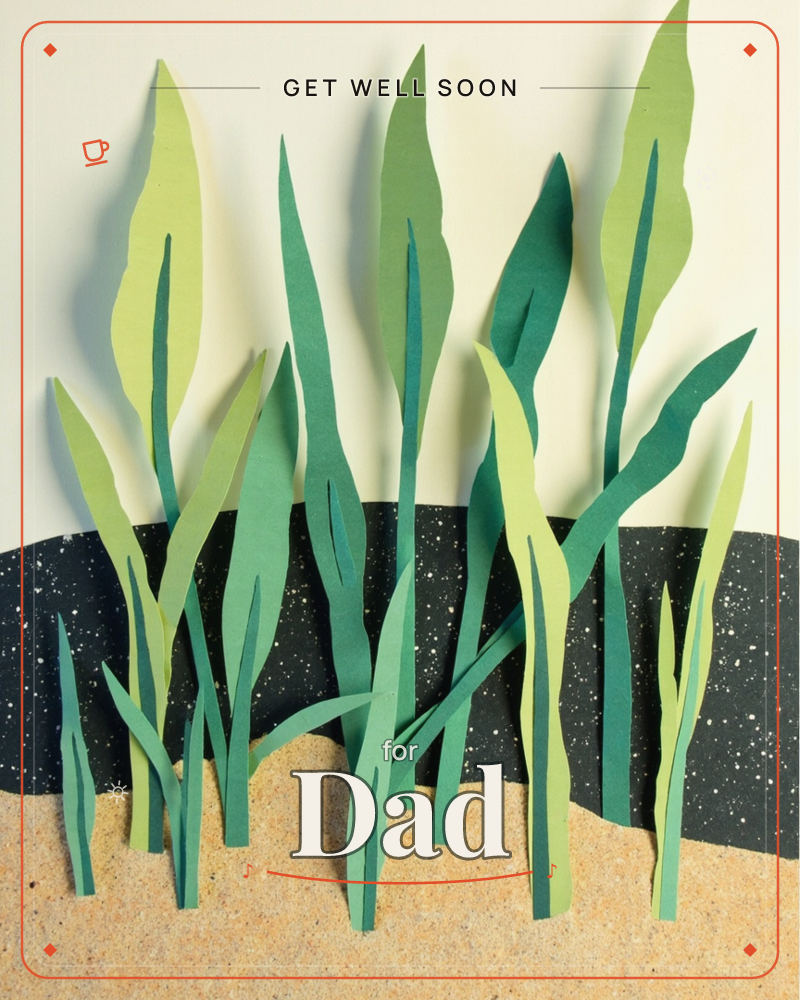 A cluster of tall grass blades cut from layered paper rises against a speckled black hill and a pale cream sky, each leaf shaded with a darker strip…, a getwell e-card design
