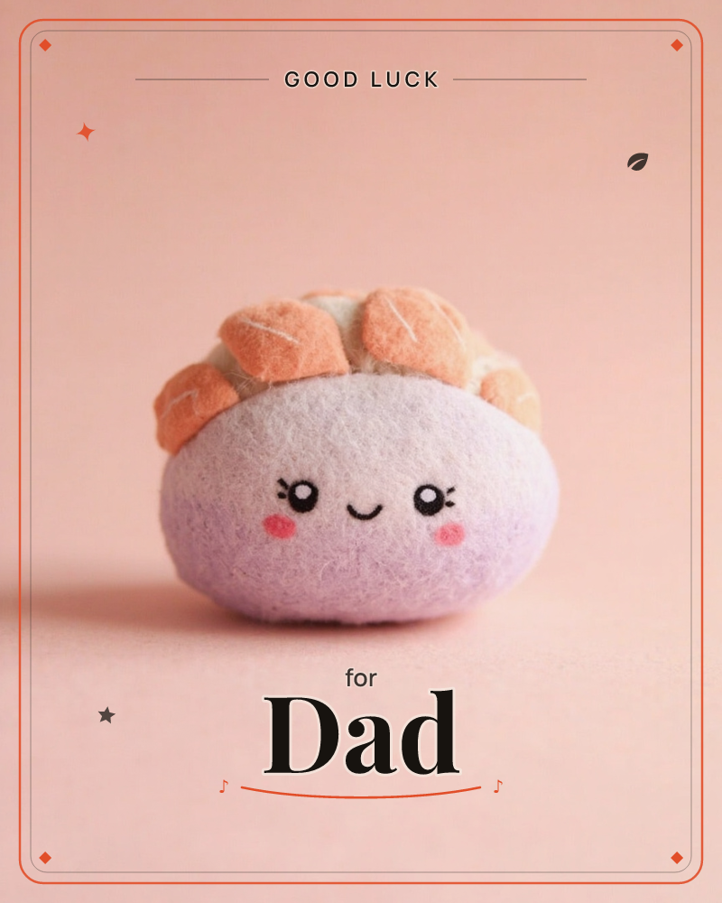 A small felt plush shaped like a bun or dumpling sits centre-stage on a soft pink backdrop, its lilac body topped with stitched orange petal shapes…, a good luck e-card design