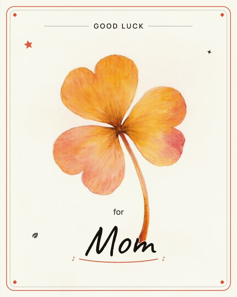 A single four-leaf clover is painted in warm autumnal tones, its heart-shaped leaflets shading from golden orange to rosy pink at the edges, a good luck e-card design