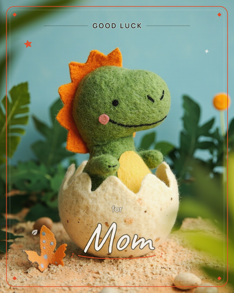 A felted wool dinosaur with an orange spiked mane pokes cheerfully out of a speckled cream eggshell, set on sandy ground among tropical leaves, a good luck e-card design