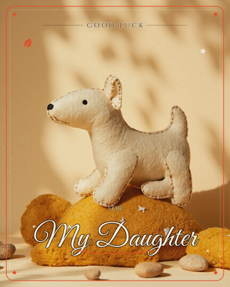 A handstitched felt dog in cream stands proudly atop a mound of golden felted wool scattered with tiny star stitches, a good luck e-card design