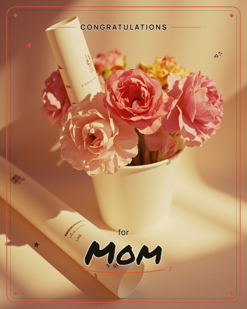 A small white pot holds a cluster of full pink roses with a rolled paper scroll tucked among the blooms, another scroll lying loose on the table beside it, a graduation e-card design