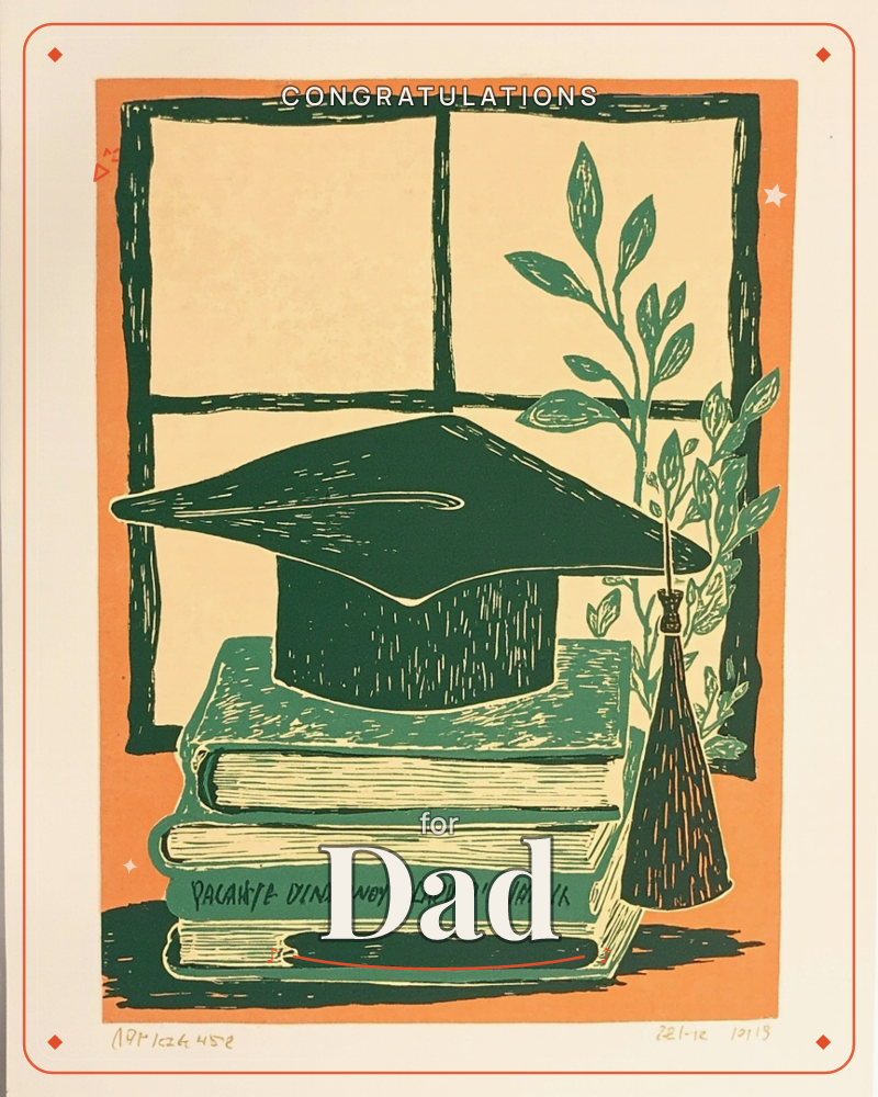 A linocut-style print shows a graduation cap resting atop a stack of well-worn books, its gold tassel swinging beside a window with a leafy plant…, a graduation e-card design