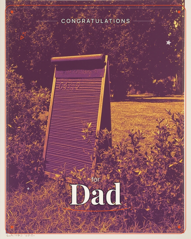 An old-fashioned washboard stands propped up like a signboard amid a tangle of leafy shrubs, set against a sunlit lawn and a dense line of trees, a graduation e-card design