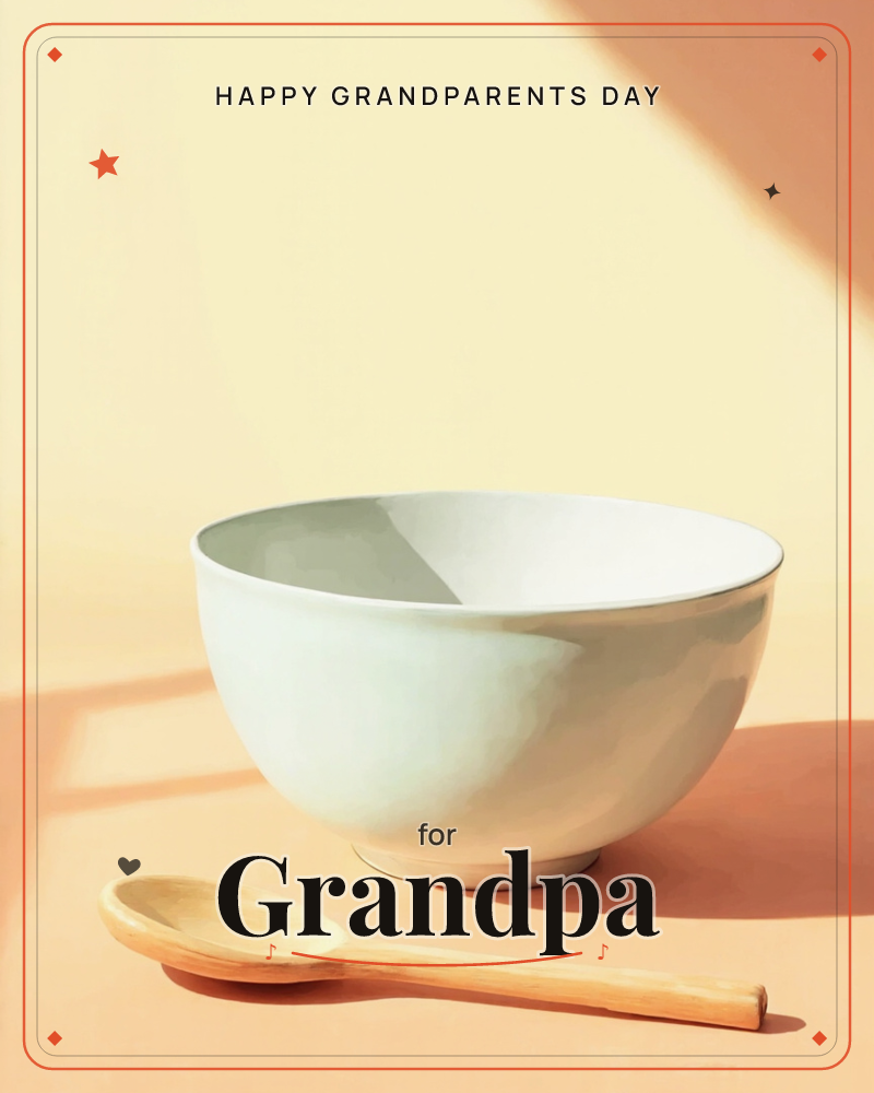 A simple white ceramic bowl sits on a warm peach-toned surface beside a wooden spoon, lit by strong diagonal sunlight that cuts a sharp shadow across…, a grandparents day e-card design