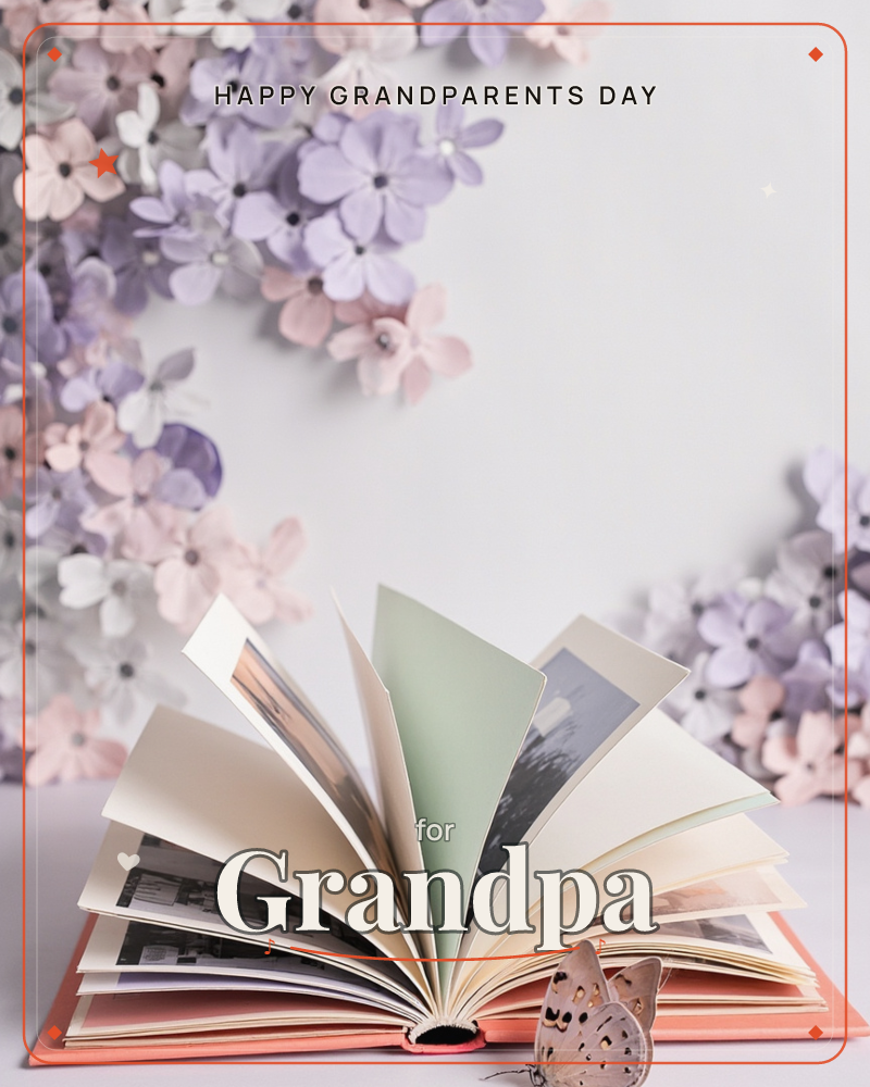 An open book with coral-red covers fans its pages across a pale tabletop, its cream, mint and ivory leaves showing glimpses of black-and-white photographs, a grandparents day e-card design