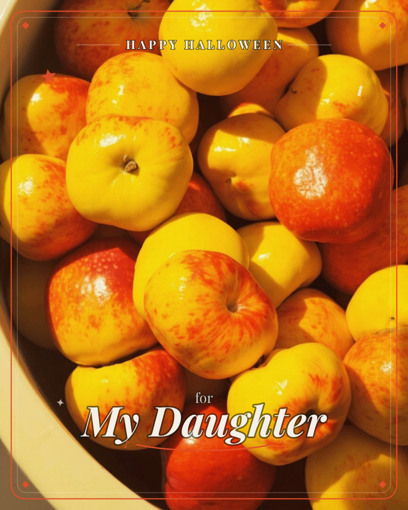 A large bowl is piled high with freshly picked apples, their yellow skins streaked and blushed with orange-red, a halloween e-card design
