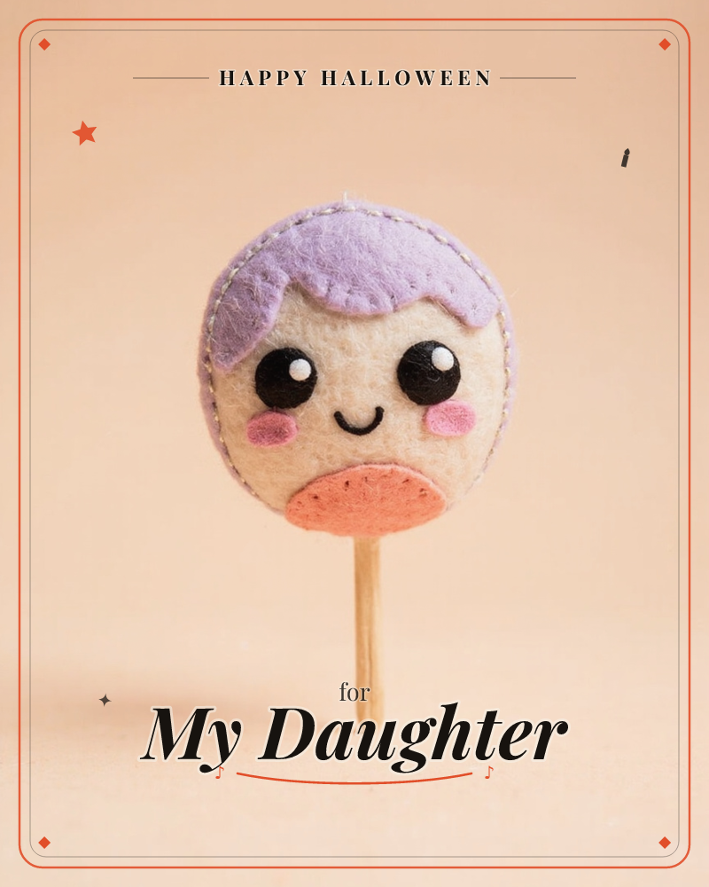 A handmade felt lollipop character stands on a wooden stick against a warm peach backdrop, with lilac hair, round black eyes, rosy pink cheeks, and a…, a halloween e-card design