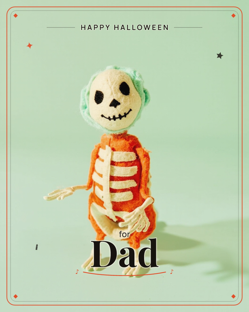 A handmade felt skeleton figure stands against a soft mint-green backdrop, its orange body stitched with pale ribs and its round head fringed with a…, a halloween e-card design