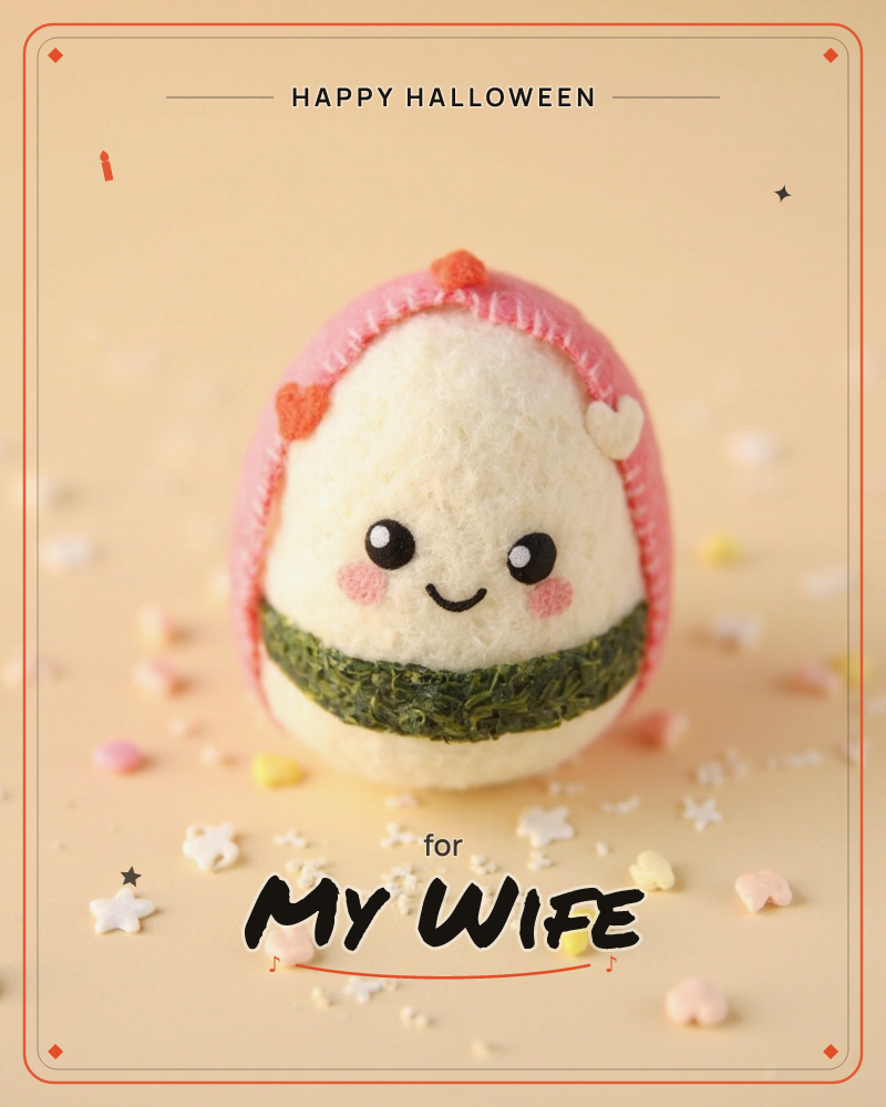 A felted rice-ball character with a cheerful smiley face sits front and centre, wrapped in a pink felt hood and a dark green nori band, a halloween e-card design