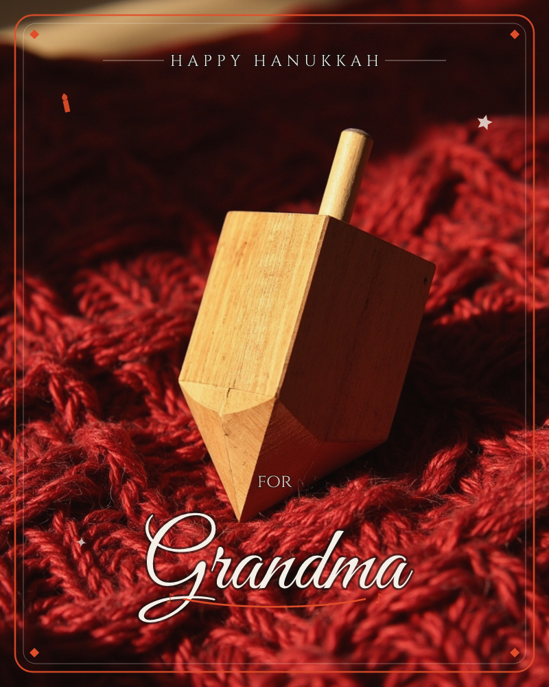 A wooden dreidel rests on its point atop a thick, cable-knit red wool blanket, caught in a warm shaft of light that picks out the grain of the timber, a hanukkah e-card design