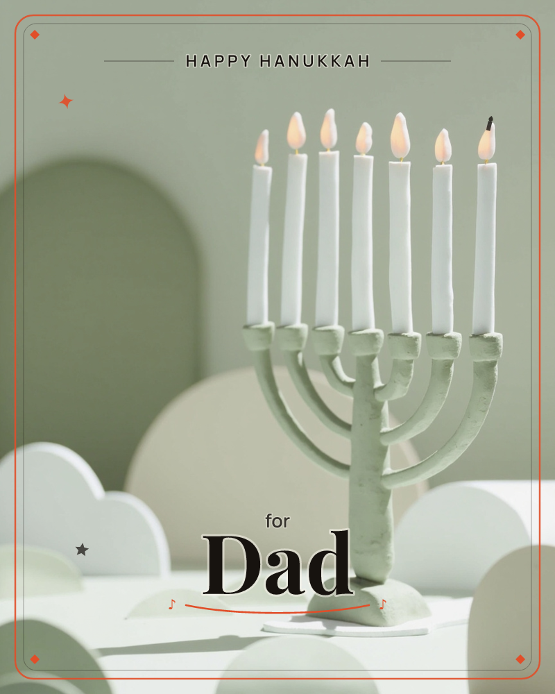 A sage-green seven-branched menorah stands on a white tabletop, its candles glowing with soft flame-shaped lights against a matching sage backdrop, a hanukkah e-card design