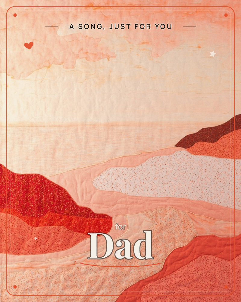 A quilted textile landscape shows layered dunes and headlands in stitched fabric, rolling down toward a pale, hazy sea under a soft peach sky, a just because e-card design