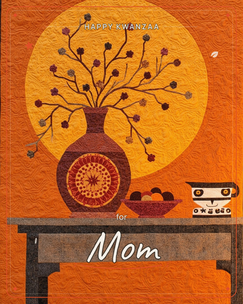 A quilted still life shows a maroon vase with a mandala medallion holding bare branches dotted with small stitched flowers, set on a wooden table…, a kwanzaa e-card design