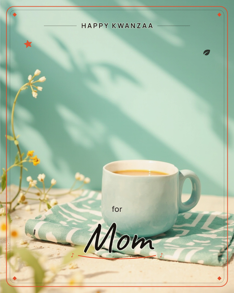 A pale teal mug of milky tea sits on a patterned green-and-white cloth against a mint wall streaked with dappled leaf shadows, a kwanzaa e-card design