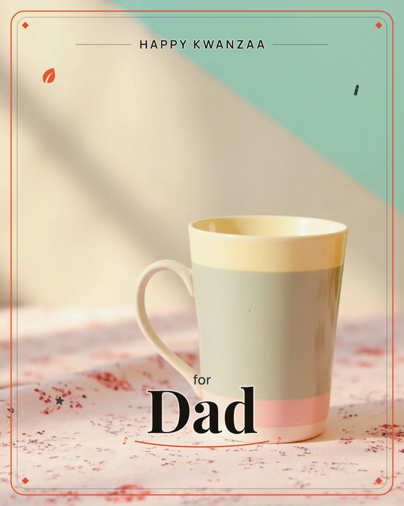 A ceramic mug banded in pale yellow, grey-blue and pink sits on a floral pink tablecloth, caught in warm diagonal sunlight against a mint-green wall, a kwanzaa e-card design