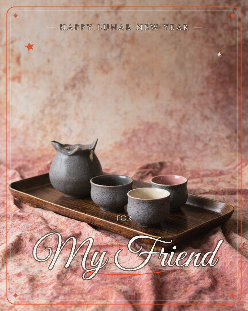 A dark wooden tray holds a rustic grey ceramic pitcher and three small handmade cups, their glazed interiors in grey, cream and dusty pink, set against…, a lunar new year e-card design