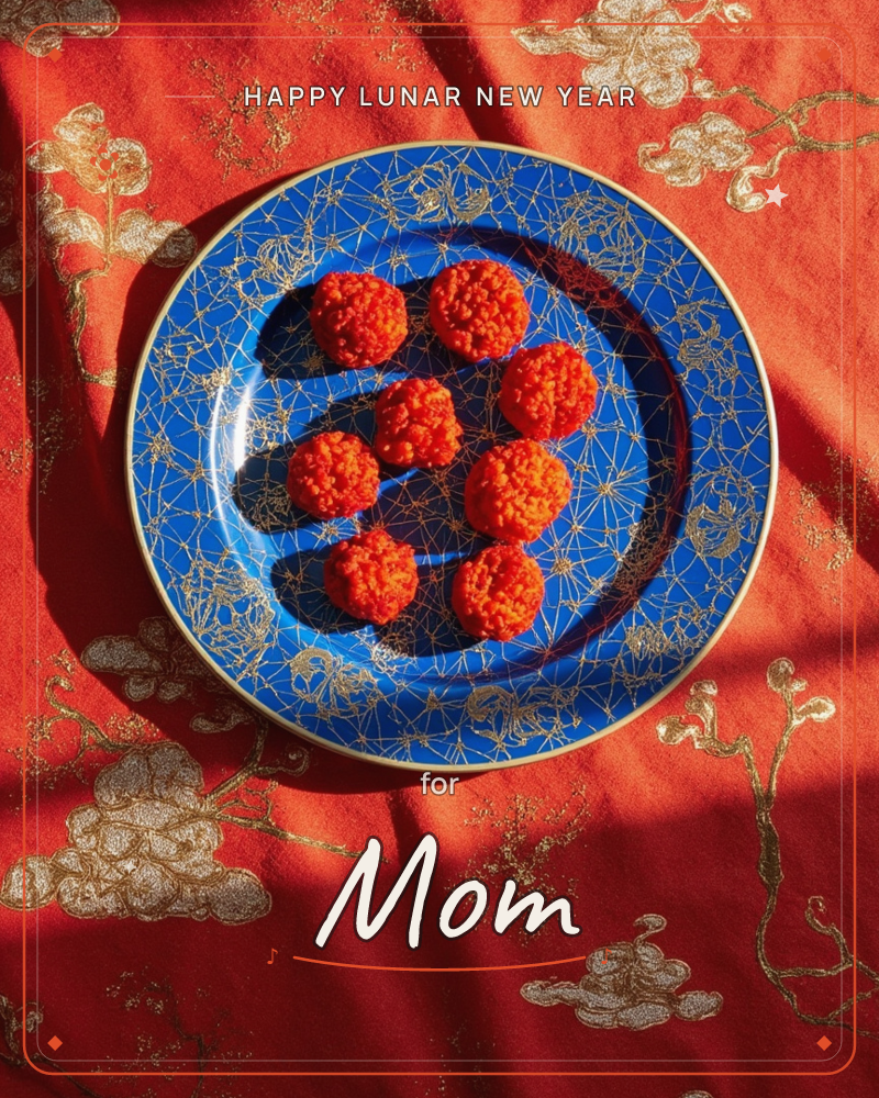 A cobalt-blue plate etched with fine gold linework holds seven round orange sweets, arranged like a cluster of small suns, a lunar new year e-card design