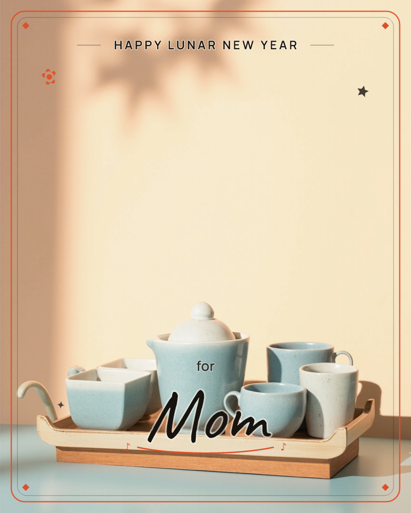 A pale blue ceramic tea set sits on a wooden tray against a warm peach wall, the teapot flanked by small cups, a sugar bowl and a milk jug, a lunar new year e-card design