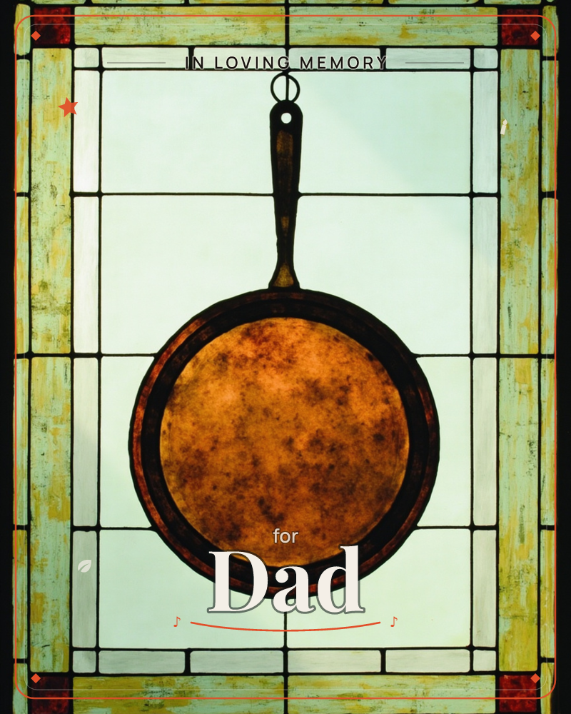 A stained-glass window design frames a well-worn cast-iron skillet hanging by its handle from a small hook, a memory e-card design