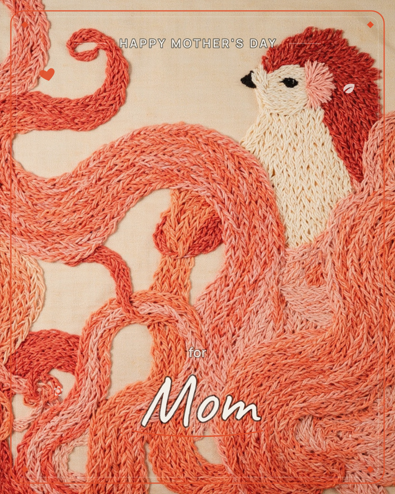 An embroidered hedgehog with a cream face and coral-tipped quills peeks out from a swirl of thickly stitched loops in shades of peach and rust, a mothersday e-card design