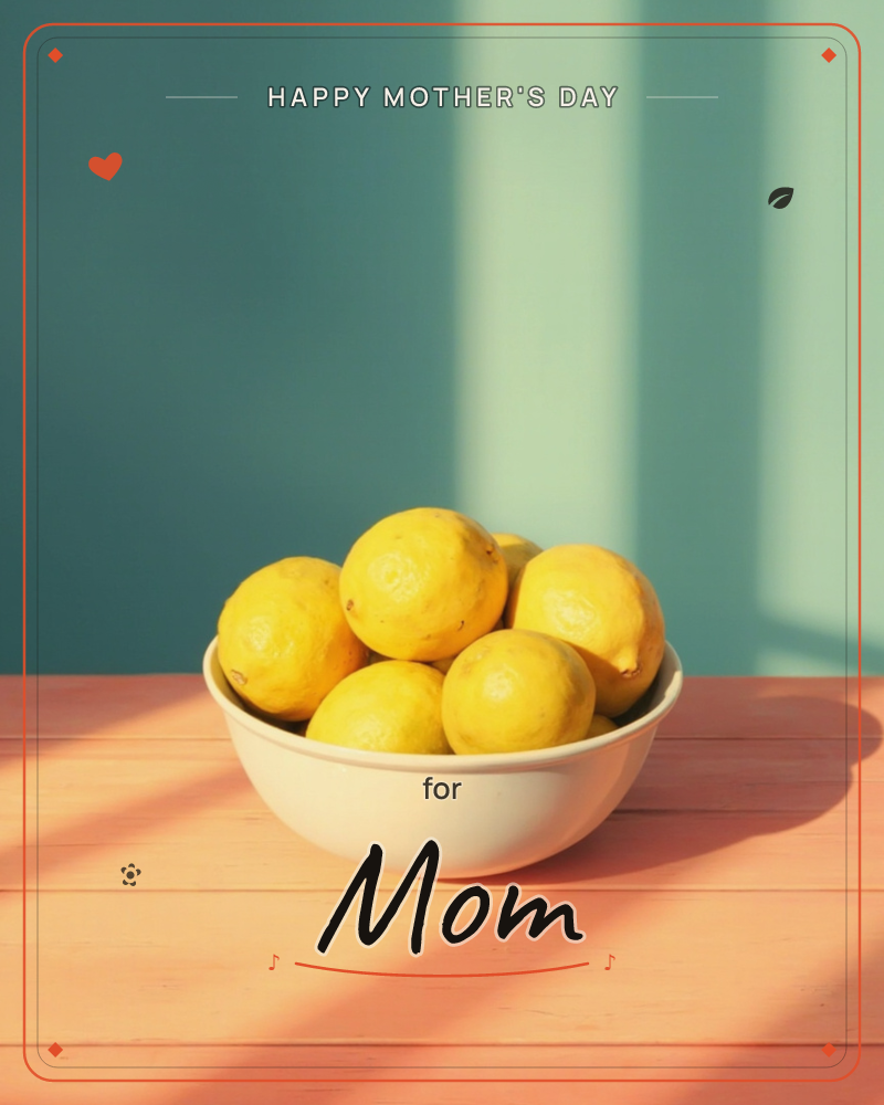 A white bowl piled with bright yellow lemons sits on a coral-pink wooden table against a muted teal wall, a mothersday e-card design