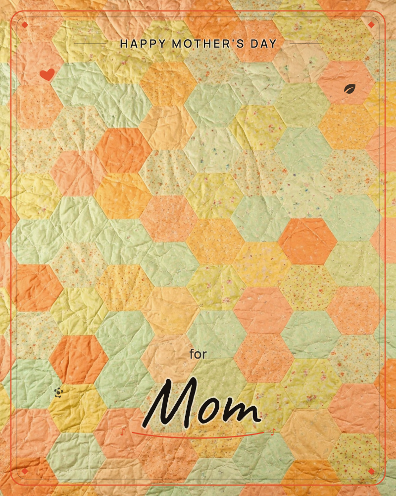 A patchwork quilt made of hand-stitched hexagons in soft orange, sage green and buttery yellow, some plain and some scattered with tiny floral prints, a mothersday e-card design