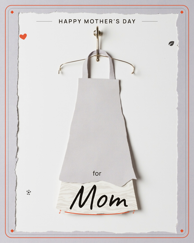 A simple dress or apron shape is cut from torn paper and hung on a delicate gold wire hanger against a plain white deckle-edged card, a mothersday e-card design