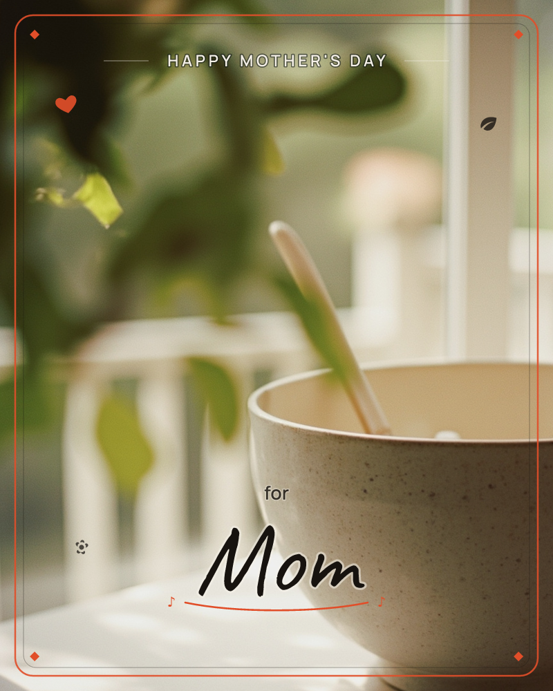A speckled ceramic bowl with a wooden spoon sits on a white ledge beside a sunlit window, soft green leaves blurring in the foreground, a mothersday e-card design