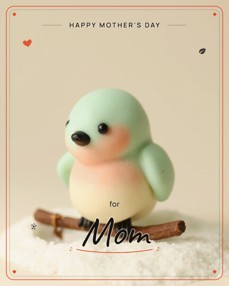 A round, clay-like bird figurine in mint green with a blushing pink cheek and pale cream belly perches on a small twig, its feet nestled in a drift of…, a mothersday e-card design