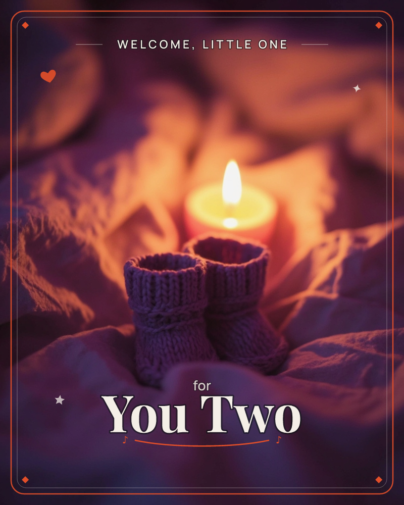 A pair of tiny knitted booties sits nestled in rumpled fabric, glowing beside a lit candle in a darkened room, a new baby e-card design