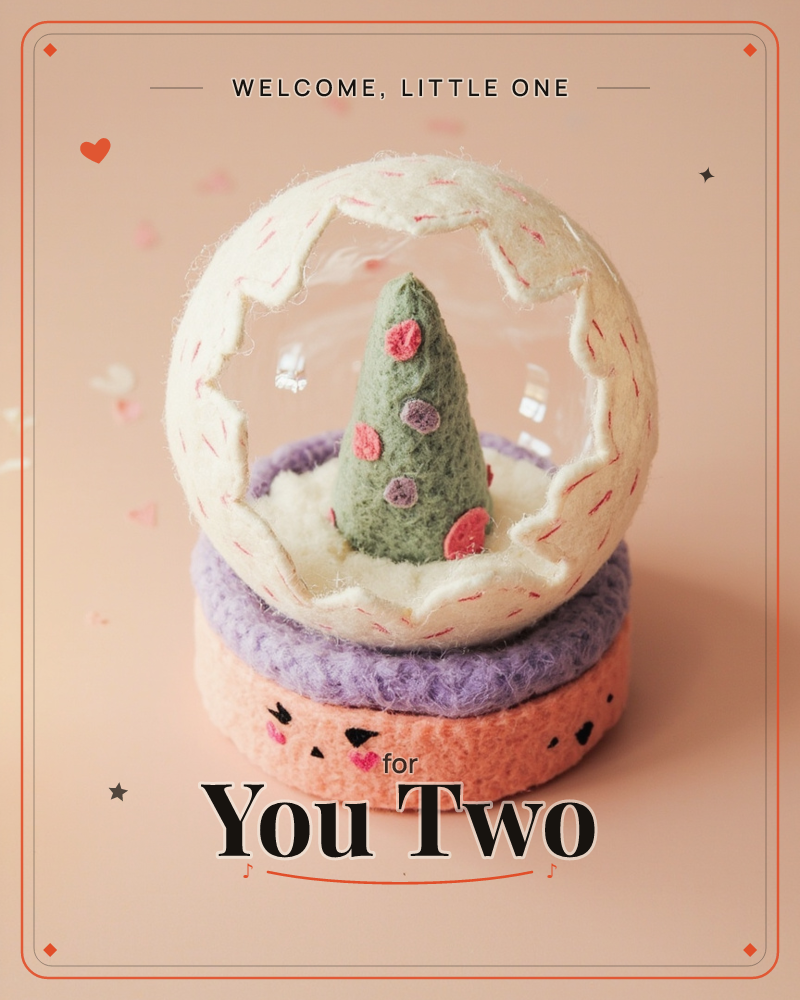 A snow globe crafted entirely from felted wool sits on a soft peach backdrop, its clear dome ringed with a cream, jagged felt edge stitched with pink…, a new baby e-card design