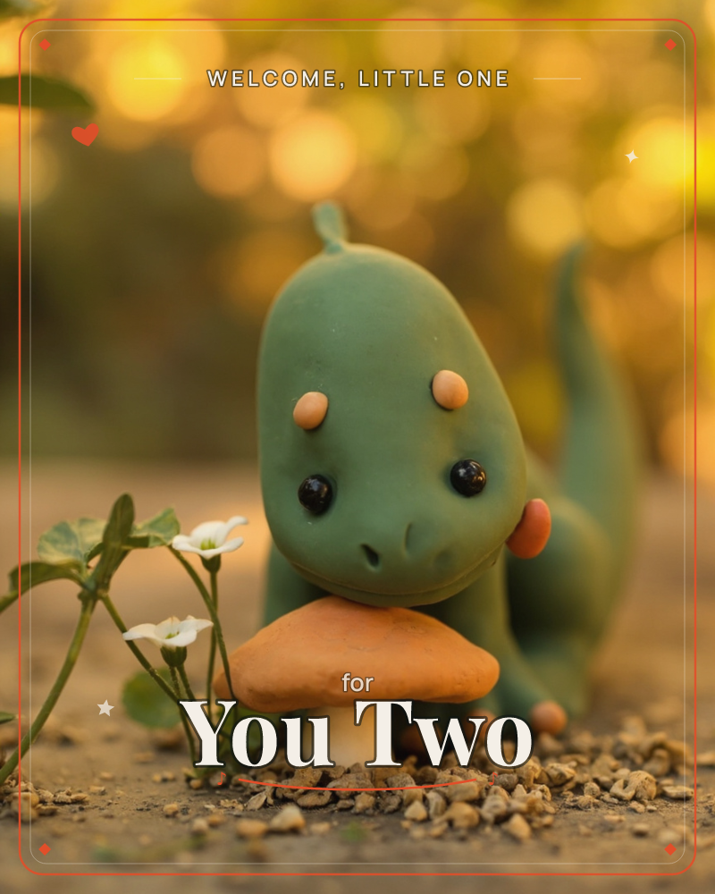 A small clay dinosaur figure with big glossy eyes peers down at an orange mushroom growing beside a tiny white-flowered plant, set on gravelly ground, a new baby e-card design