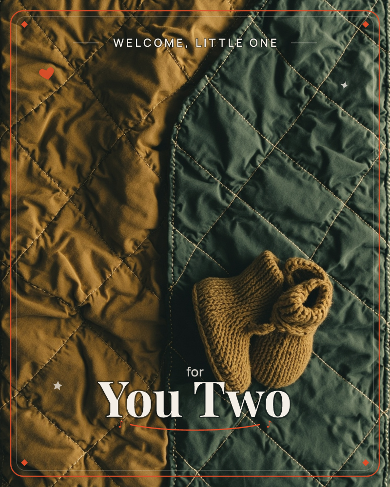A pair of small knitted booties rests atop a quilted blanket split into rich rust and deep forest-green panels, their diamond stitching catching soft…, a new baby e-card design