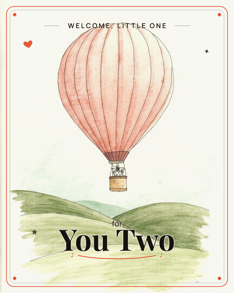 A pink hot air balloon drifts alone over a soft, rolling green countryside, its basket small against a pale sky, a new baby e-card design