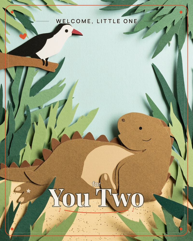 A paper-craft jungle scene shows a smiling brown dinosaur with a spiked back lounging on sandy ground, chatting up at a black-and-white bird with a red…, a new baby e-card design